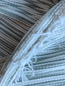 Handmade handwoven white and grey rug close up