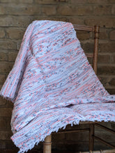 Load image into Gallery viewer, Handmade handwoven white black and pink orange rug on a chair