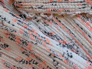 Handmade handwoven white black and pink orange rug details