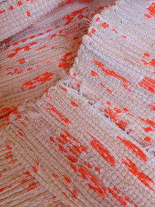 Handmade handwoven pink pattern cotton rug close up details