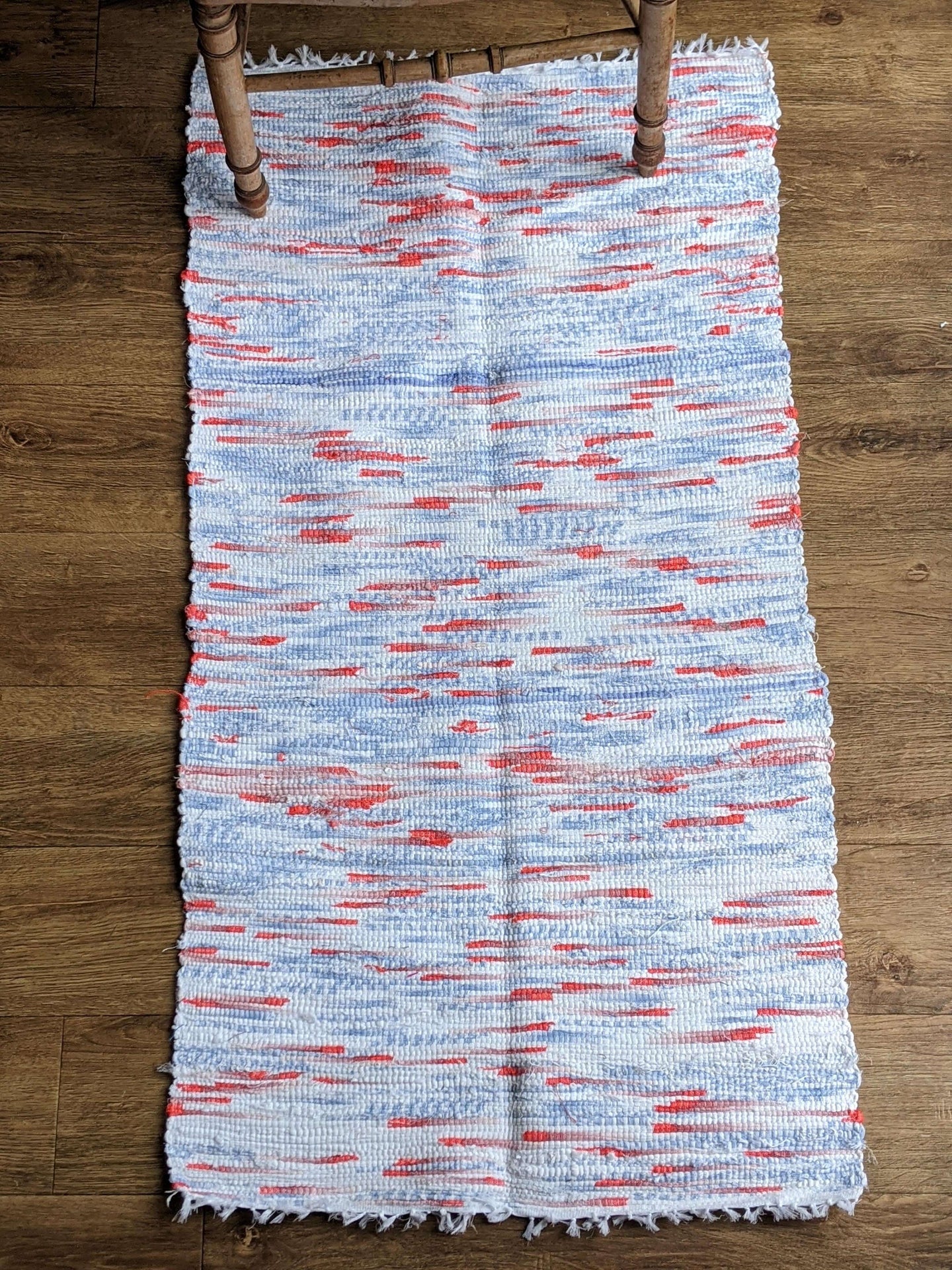Handmade blue white and orange cotton rug