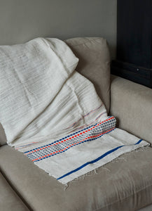 Handmade woven cotton white blue and orange throw blanket