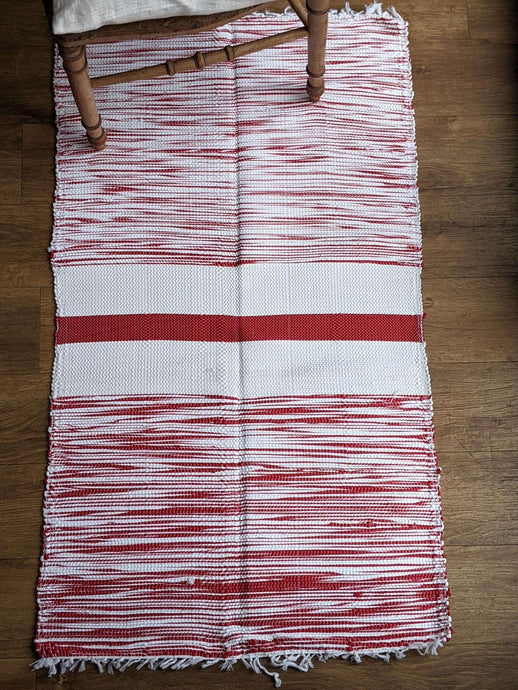 Handmade red and white pattern cotton rug