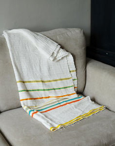 Handmade multicoloured cotton blanket throw on sofa