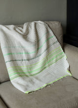Load image into Gallery viewer, Handmade green and white cotton blanket laid on a sofa