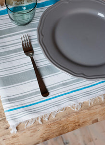 Handmade cotton set of placemats in grey and blue stripes. Sustainable, ethical sourcing