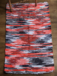handmade woven cotton sustainable red and black striped rug